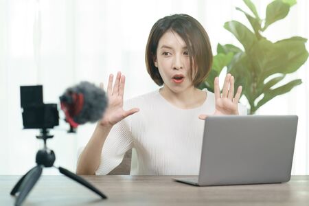Female blogger recording broadcast video at home, Fashion, makeup, technology conceptの写真素材