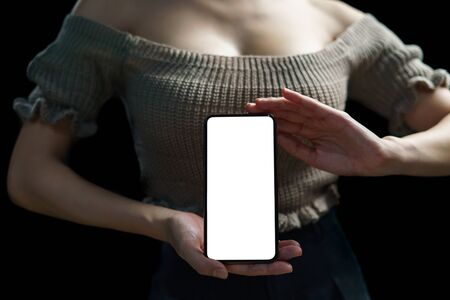 woman showing white blank display of her mobile phone.の写真素材