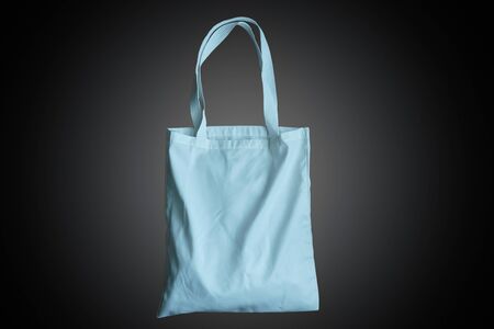 Reusable bag for groceries and shopping, red fabric tote bag on red background.の写真素材