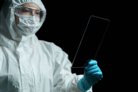 Doctor hand hold transparent tablet display showing empty in screen.の写真素材