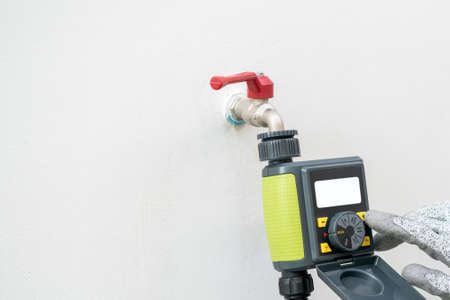 Digital garden timer, hand setup schedules program for garden watering.の写真素材