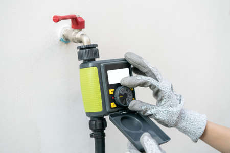 Digital garden timer, hand setup schedules program for garden watering.の写真素材