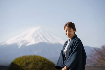 woman tourist in Yukata dress at Mt Fuji, lake kawaguchiko, Japan.の写真素材