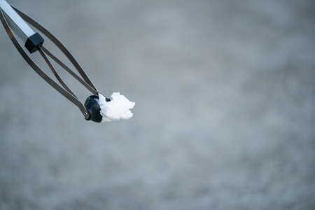 Garbage collector equipment keeping used dirty tissue on the ground.の写真素材