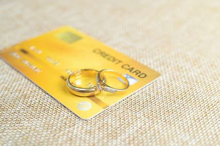 Gold wedding rings with credit cards,  pay the cost by credit card.の写真素材