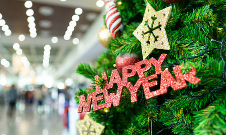 Christmas tree with decoration, happy new year label and gift. Merry Christmas and Happy New Year.の写真素材