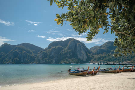 View long tail boat docking at harbor on Ton Sai Bay, Phi Phi Islands, Andaman Sea, Thailand.の写真素材
