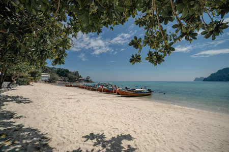 View long tail boat docking at harbor on Ton Sai Bay, Phi Phi Islands, Andaman Sea, Thailand.の写真素材