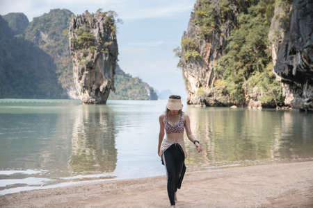 Woman tourist in swimsuit posing on  island, Phang Nga, Thailand.の写真素材
