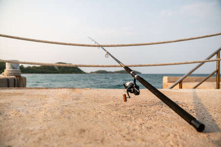 A fishing rod with sea background, fishing.の写真素材
