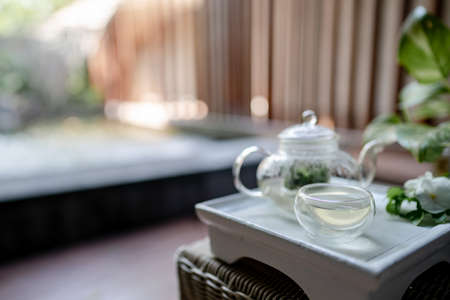 The tray of transparent teapot with herbal tea.の写真素材