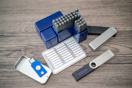 Hardware cryptocurrency wallet with metal  plates. Safe storage for crypto.の写真素材