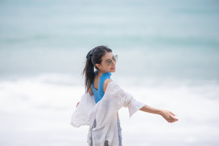 Sexy woman relaxing on the beach.の写真素材