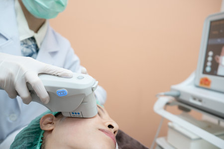 Beautician procedure by electric device,Ultrasound therapy treatment for skin tightening in...