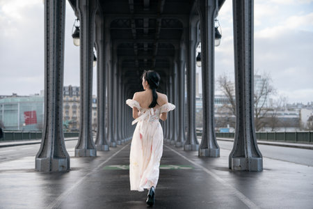 Woman portrait under Bir Hakeim bridge. Paris, France.の写真素材