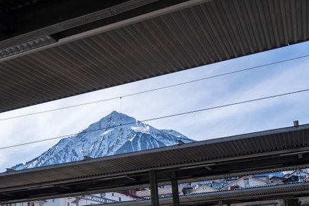 Platform at railway station with snowy mountain background, Switzerland.の写真素材