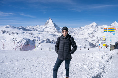Woman with Matterhorn mountain in the Morning. Zermatt, Switzerland.の写真素材