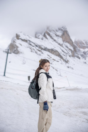 Woman enjoy view snow in Seceda mountain. Italian Alps, Dolomites, Italy.の写真素材