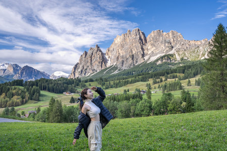 Woman enjoy view of Cortina D Ampezzo mountains landscape Dolomites, Italy.の写真素材