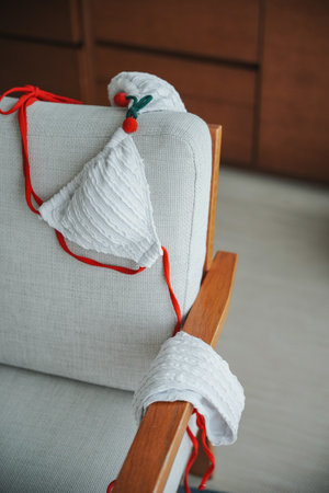 Close up of woman bra throwing at wooden chair.