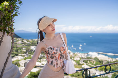 Woman in Capri Island enjoying landscape from viewpoint Capri, Italy.の写真素材
