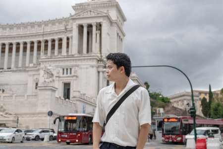 Man with Monument to Victor Emmanuel II  also known as Fatherland in Rome, Italy.