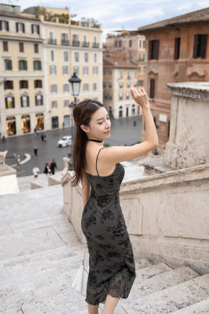 Woman enjoy view of  Spanish steps (piazza di spagna) in Rome, Italy.の写真素材