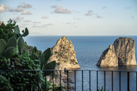 Aerial view of beautiful coastal cliffs  faraglioni di mezzo in Capri Island, Italy.の写真素材