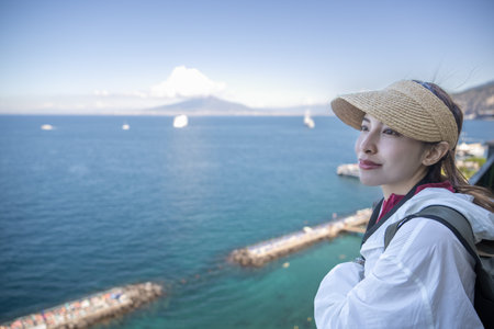 Woman enjoy view of Lionellis Beach Club in Sorrento in Summer. Sorrento, Italyの写真素材