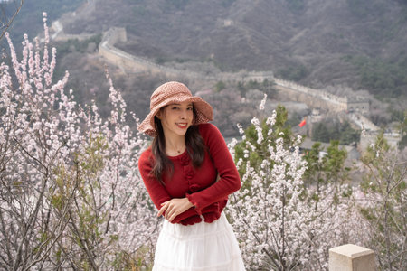 Woman enjoying view of great wall of China.