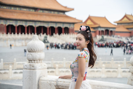 Woman with Traditional Contemporary Chinese costume and headband in Forbidden City in Beijing, China.の写真素材