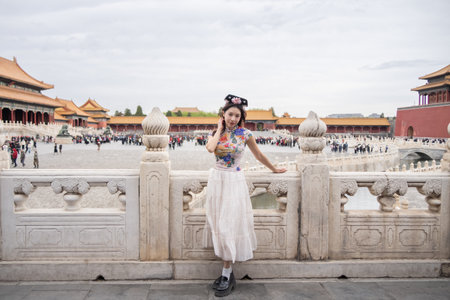 Woman with Traditional Contemporary Chinese costume and headband in Forbidden City in Beijing, China.の写真素材