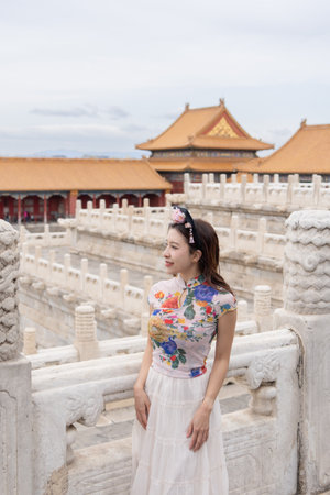 Woman with Traditional Contemporary Chinese costume and headband in Forbidden City in Beijing, China.の写真素材