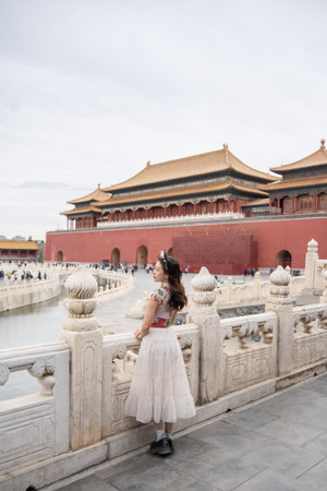 Woman with Traditional Contemporary Chinese costume and headband in Forbidden City in Beijing, China.の写真素材