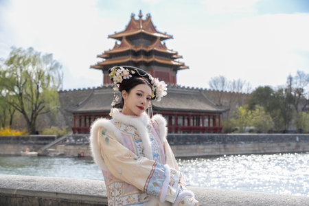 Woman wearing traditional Chinese dress in forbidden city, Beijing, China.の写真素材