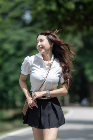 Student girl walk in the park outdoor.の写真素材