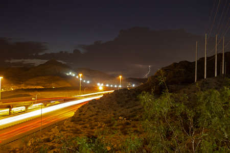 Lightning storm over asphalt road taken at long exposure