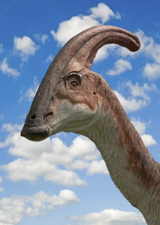 Dinosaur Parasaurolophus head - sky backgroundの写真素材