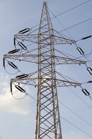Electric power lines on a blue sky background の写真素材