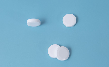 white tablets on blue backgroundの写真素材