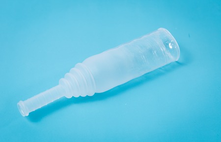 External condom catheter used in patient care or for incontinent patient at the blue backgroundの写真素材