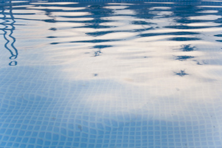 Closeup photo of wavy blue pool waterの写真素材
