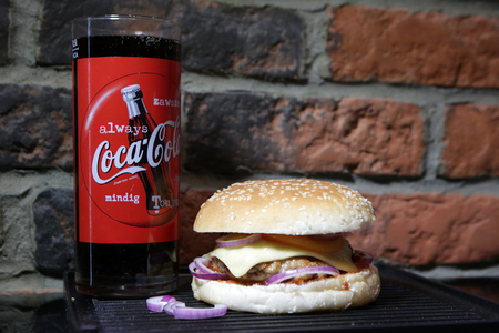 KRAKOW, POLAND - JANUARY 05, 2017, Coca cola and Hamburger with beef, cheese, onion, tomato and sauce. Homemade burger.のeditorial素材