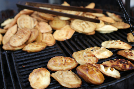 Traditional Polish smoked cheese made of salted sheep milk known as oscypek on barbecueの写真素材