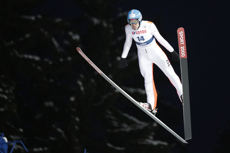 ZAKOPANE, POLAND - JANUARY 22, 2016: FIS Ski Jumping World Cup in Zakopane o/p Sabirzhan Muminov KAZのeditorial素材
