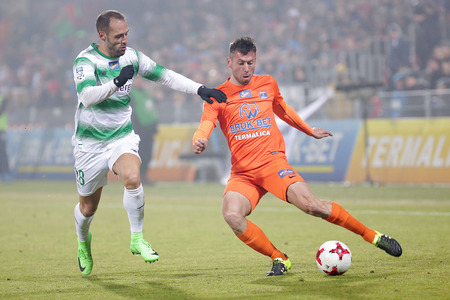 NIECIECZA, POLAND - FEBRUARY 17, 2017: Polish Premier Football League Termalica Bruk-Bet Nieciecza - Lechia Gdansk o/p Sebastian Ziajka Flavio Paixaoのeditorial素材