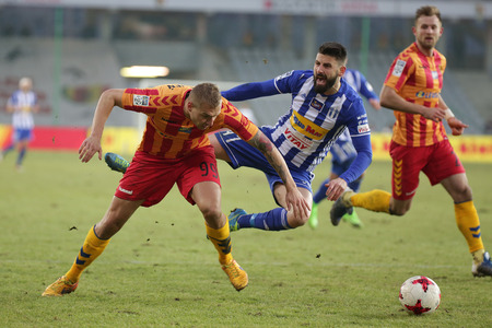 KIELCE, POLAND - FEBRUARY 18, 2017: Polish Premier Football League Korona Kielce - Wisla Plock o/p Dimitar Iliev Bartosy Kwiecienのeditorial素材