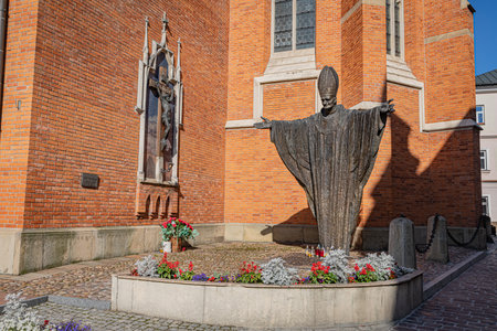 TARNOW, POLAND - OCTOBER 10, 2021: Polish city in Malopolska often called "Pearl of Polish Renaissance". Europe's most beautiful town according CNN. o / p Cathedral of the Nativity of the Blessed Virgin Mary with Jan Pawel II monumentのeditorial素材