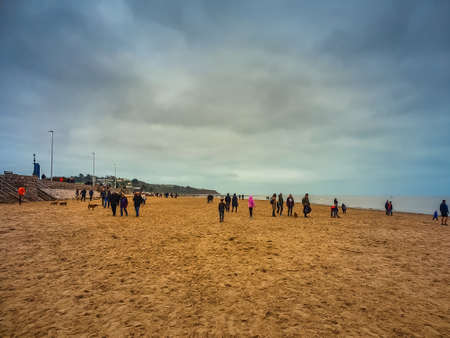 Exmouth England December 27 2019, people walking on the beach in christmas timeのeditorial素材