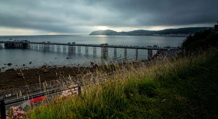 View of the pier and the town of Llandudno in Wales, United Kingdonの写真素材